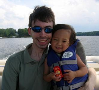 Riding the waves with Daddy in the back